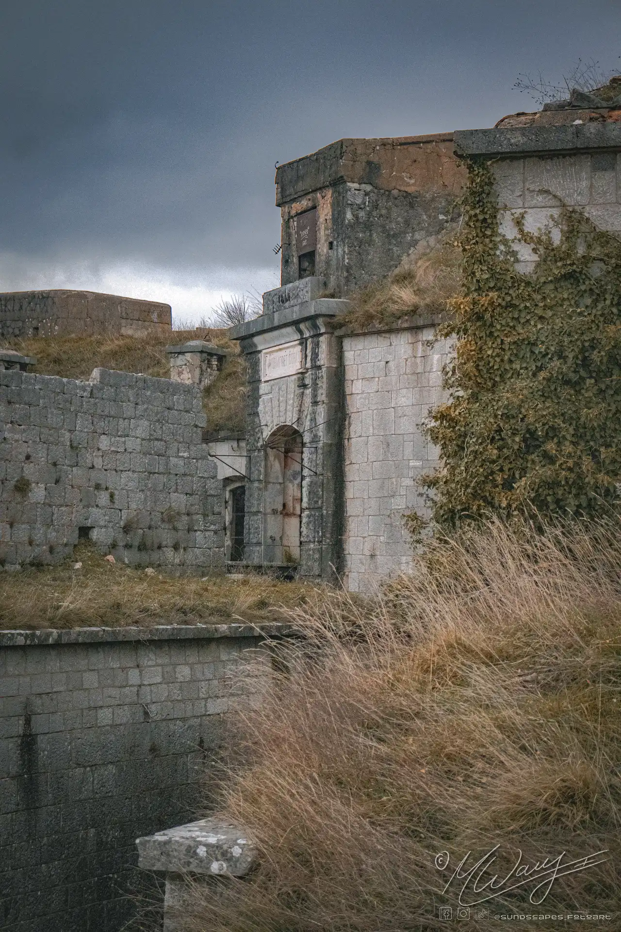 a stone building with a tall tower