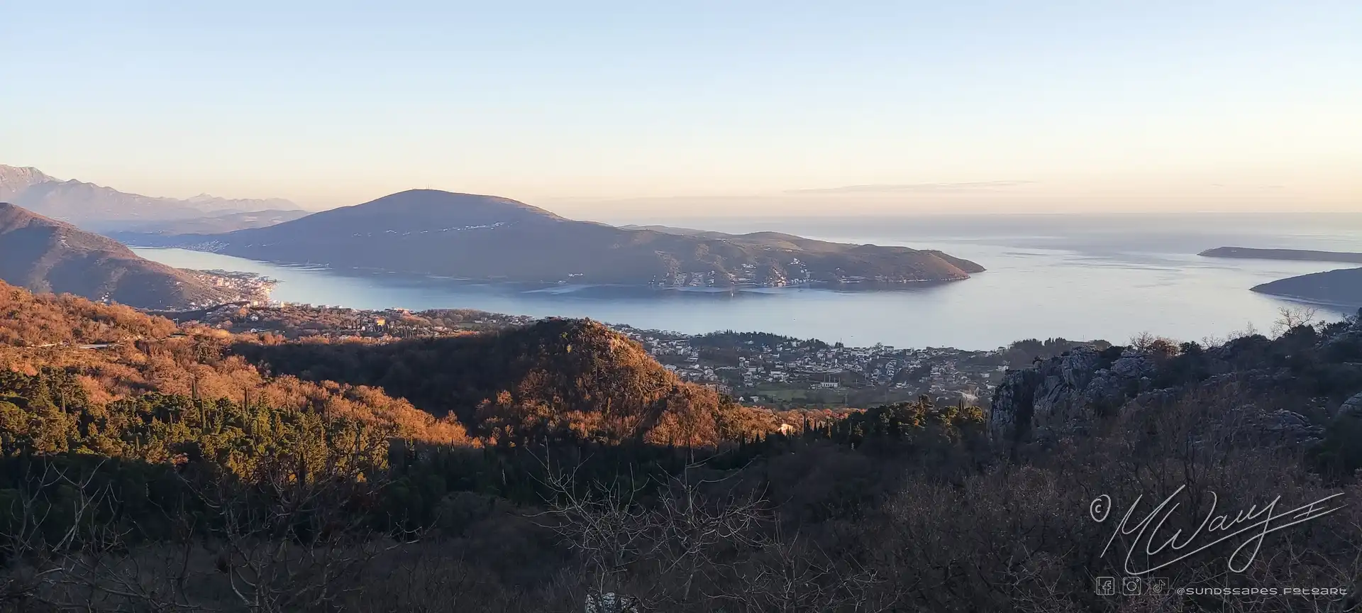 a landscape of a body of water and hills, Kotor Bay