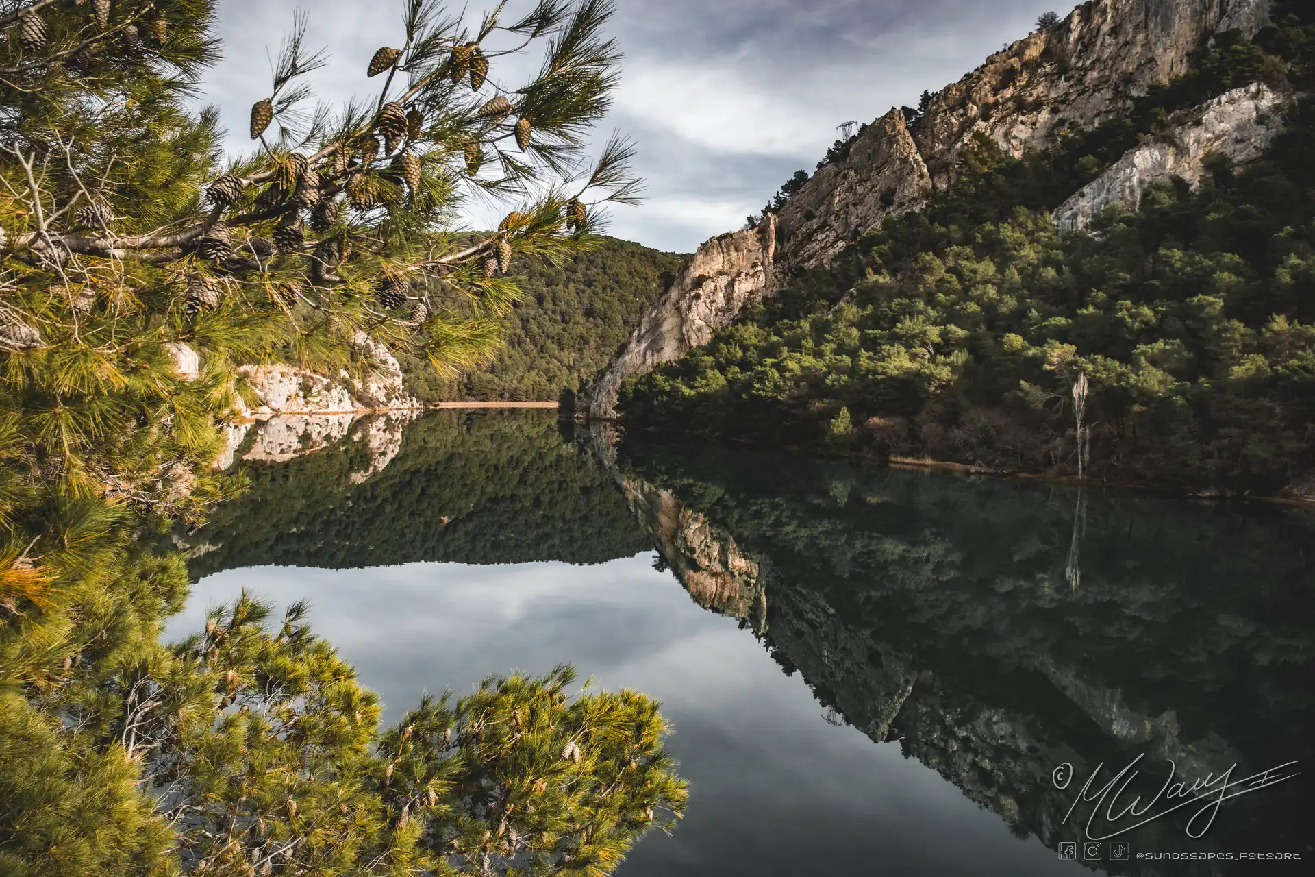 A lake in front of a mountain