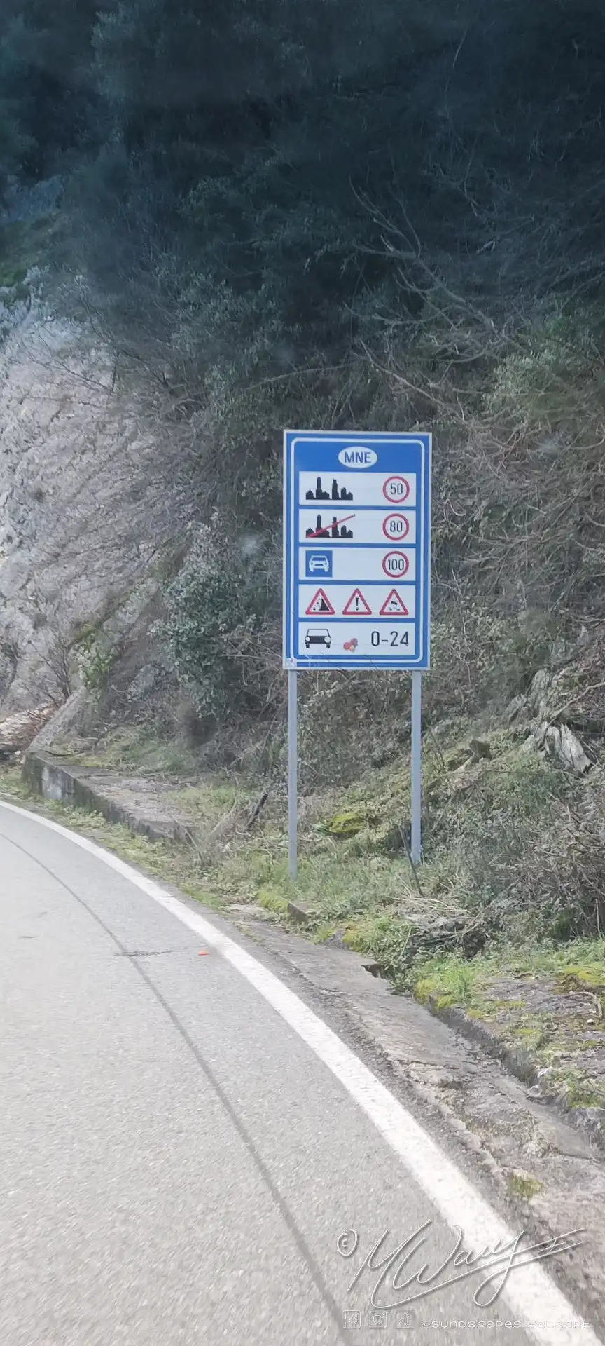 a road sign on the side of a road