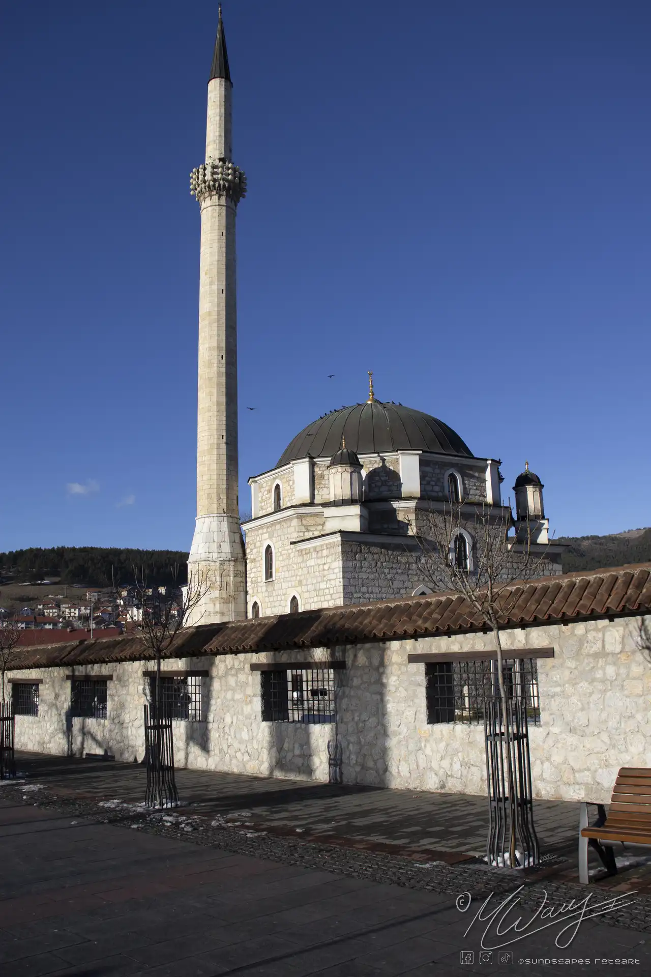 a stone building with a tall tower