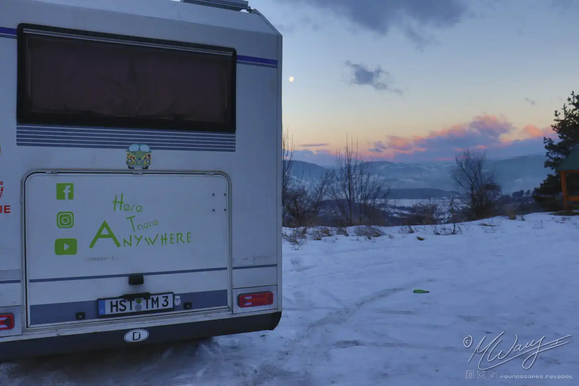 a trailer parked in the snow