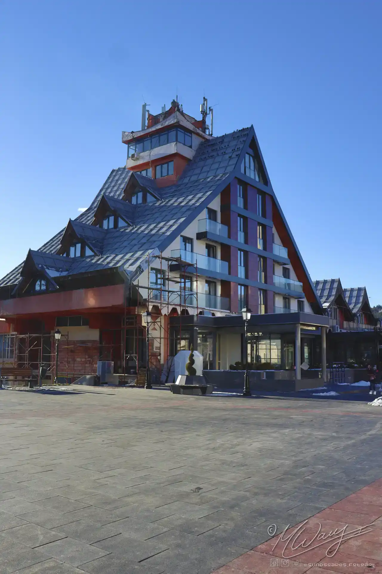 a building with a triangular roof