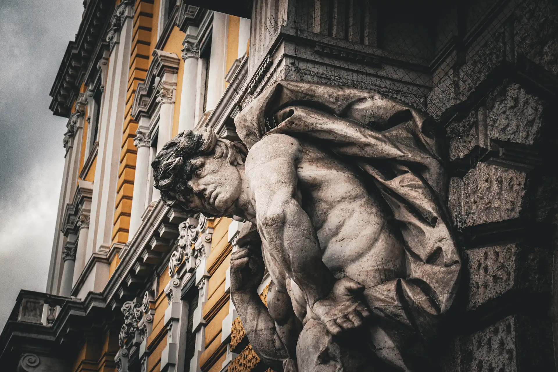 a statue of a man on a building