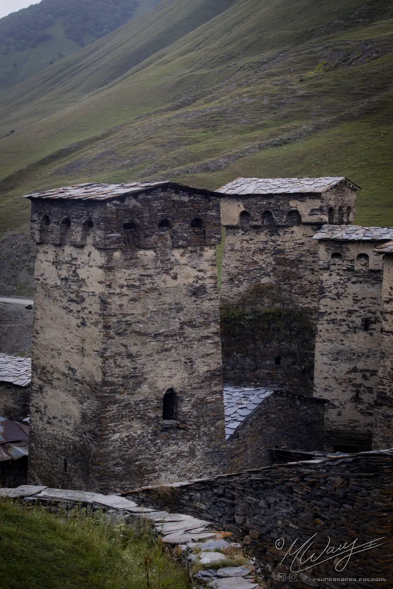 a stone building with a tall tower