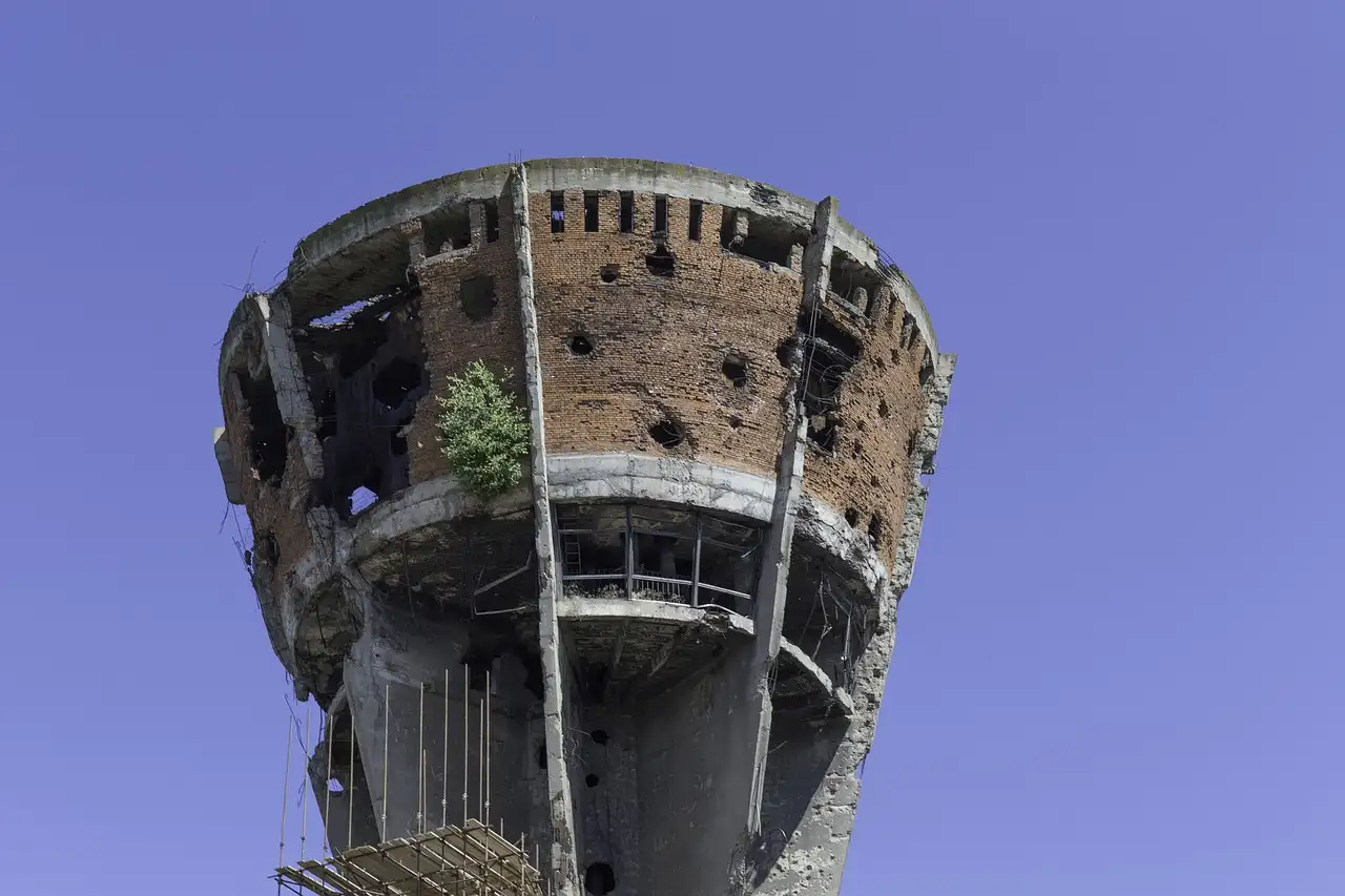 a concrete tower with holes in it